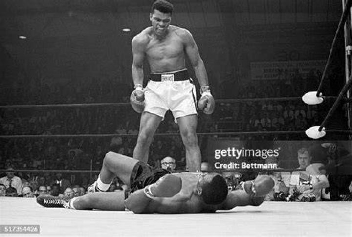 Ali Liston Heavyweight champion Muhammad Ali stands over fallen challenger Sonny Liston, shouting and gesturing shortly after dropping Liston with a short hard right to the jaw, in Lewiston, Maine. The bout lasted only one minute into the first round. Ali is the only man ever to win the world heavyweight boxing championship three times. He also won a gold medal in the light-heavyweight division at the 1960 Summer Olympic Games in Rome as a member of the U.S. Olympic boxing team. In 1964 he dropped the name Cassius Clay and adopted the Muslim name Muhammad Ali Ali Liston, Lewiston, USA