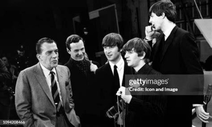 American TV host Ed Sullivan, left, talks with three members of the British pop group The Beatles during a rehearsal for their appearance on his TV show, in New York, Feb. 8, 1964. From left, Sullivan, John Lennon, Ringo Starr and Paul McCartney. George Harrison, the fourth member of the group missed the rehearsal due to illness. (AP Photo)