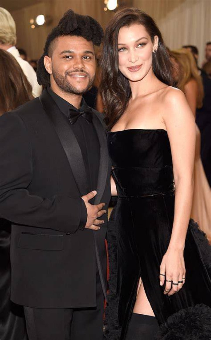 Bella Hadid and The Weeknd were spotted leaving her Manhattan NYC apartment on Friday night. The couple headed to dinner after reuniting following a busy Fashion Month for the Runway model. She flaunted her to-die-for abs in a crop top as they walked to their SUV. They were all smiles but they seemed to be playing coy about a large Diamond ring on Bella's hand. She hid one of her hands behind her back, while concealing an ENORMOUS diamond on the hand she had intertwined in the singer's. He covered the ring with 2 hands as they got into the car, just giving a quick glance at it. Pictured: Ref: SPL5028849 280918 NON-EXCLUSIVE Picture by: 247PAPS.TV / SplashNews.com Splash News and Pictures Los Angeles: 310-821-2666 New York: 212-619-2666 London: 0207 644 7656 Milan: +39 02 4399 8577 Sydney: +61 02 9240 7700 World Rights, No Portugal Rights