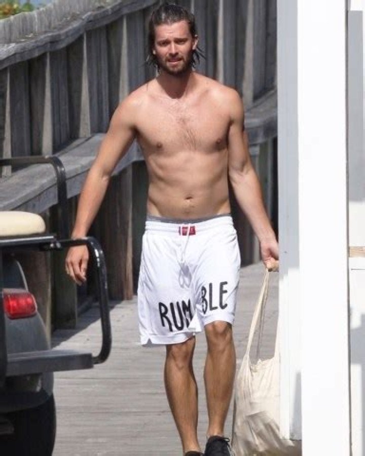 Hyannisport, MA - *EXCLUSIVE* - A shirtless Patrick Schwarzenegger is seen in Hyannisport while out running errands. Patrick looks great as he is seen out with friends while on vacation. Pictured: Patrick Schwarzenegger BACKGRID USA 6 JULY 2019 BYLINE MUST READ: Patriot Pics / BACKGRID USA: +1 310 798 9111 / UK: +44 208 344 2007 / *UK Clients - Pictures Containing Children Please Pixelate Face Prior To Publication*