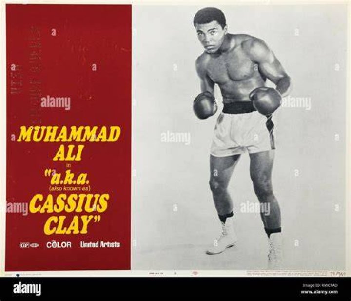 Muhammad Ali, or Cassius Clay as he was known at the time, whips a right to the head of ducking champ Sonny Liston during the first round of the heavyweight title fight in Miami Beach, Fla Boxing Champion Muhammad Ali, Miami Beach, USA