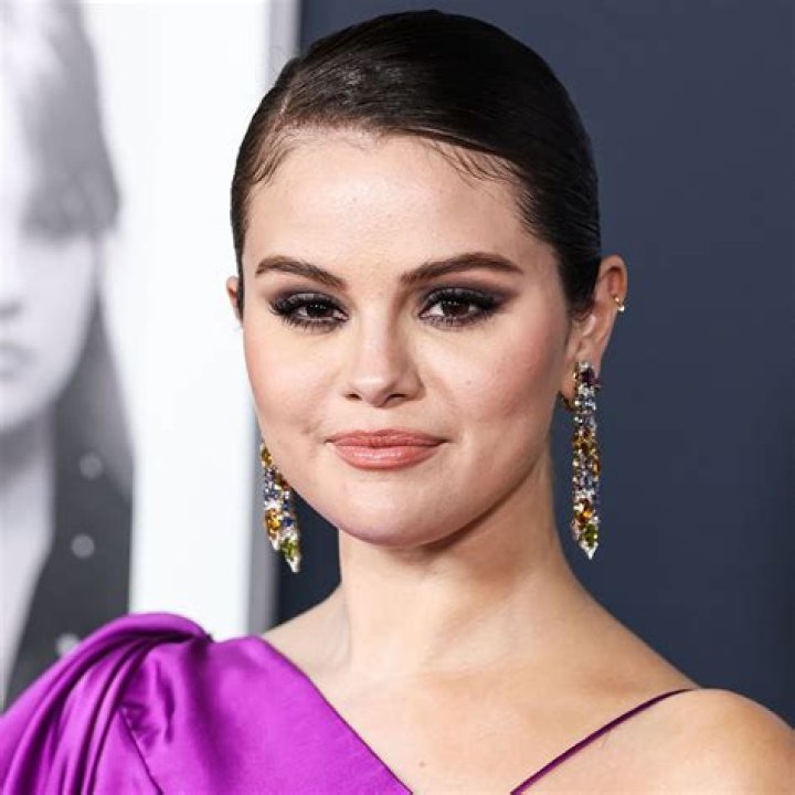 Selena Gomez Wears A Purple Blazer Leaving Z100