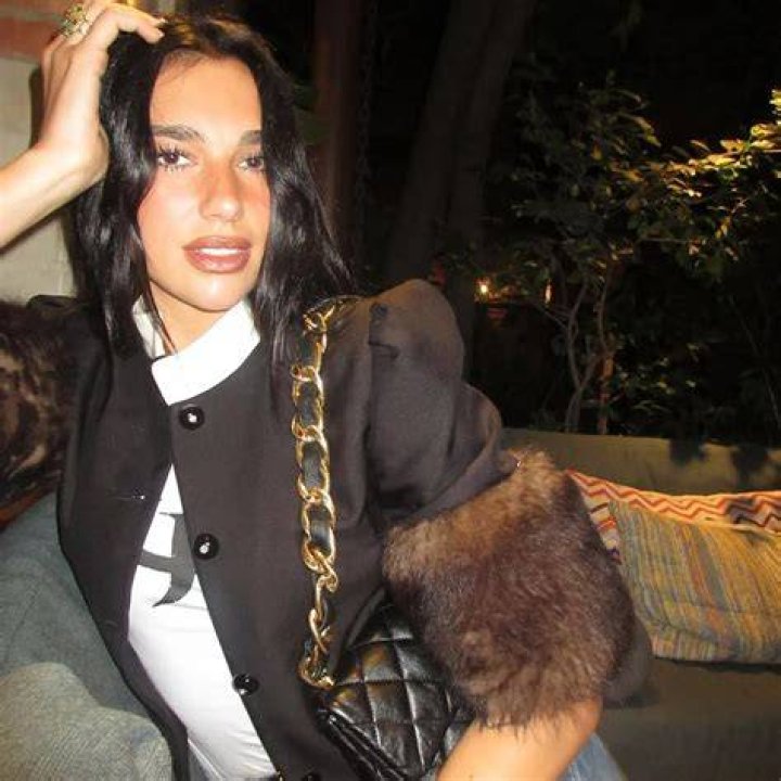 Singer Dua Lipa wears a Leopard print bikini while with her boyfriend poolside in Miami Beach, Florida. Pictured: Anwar Hadid,Dua Lipa Ref: SPL5137704 311219 NON-EXCLUSIVE Picture by: Robert O'Neil / SplashNews.com Splash News and Pictures USA: +1 310-525-5808 London: +44 (0)20 8126 1009 Berlin: +49 175 3764 166 World Rights
