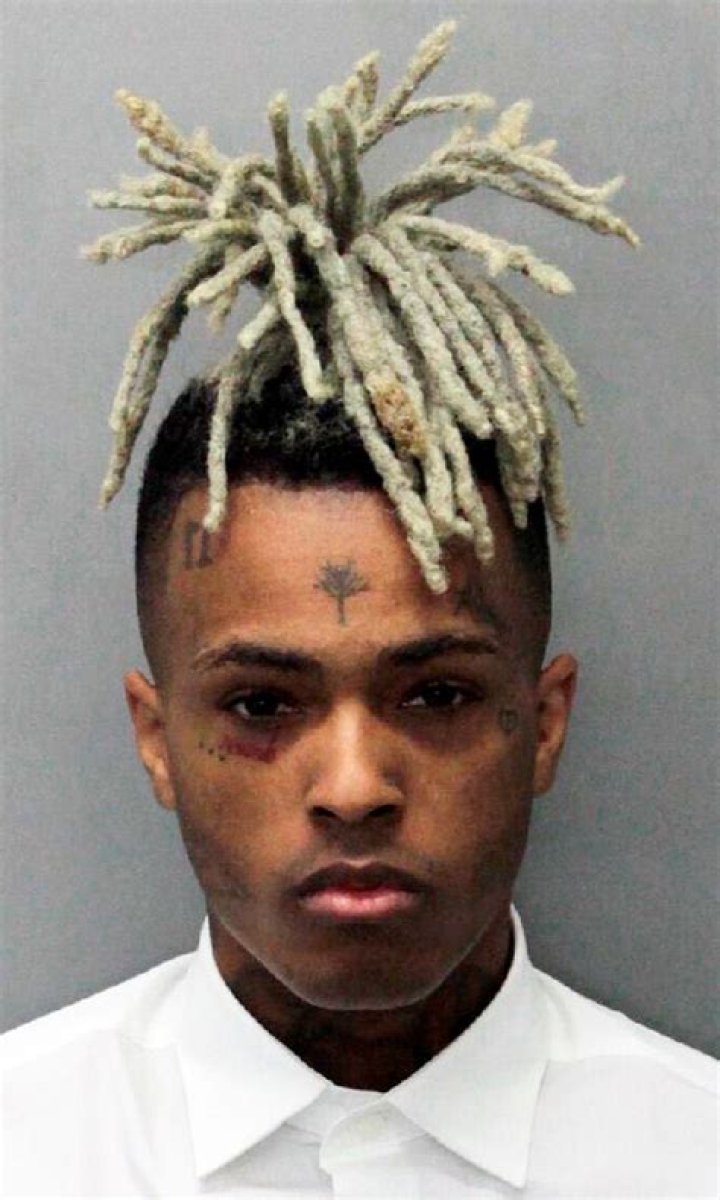 This undated mugshot released by the Miami- Dade Corrections & Rehabilitation Department shows rapper XXXTentacion. Authorities say troubled rapper-singer XXXtentacion has been fatally shot in Florida. The Broward Sheriff's Office says the 20-year-old rising star was pronounced dead at a Fort Lauderdale-area hospital. He was shot earlier outside a Deerfield Beach motorcycle dealership XXXtentacion Slain - 18 Jun 2018